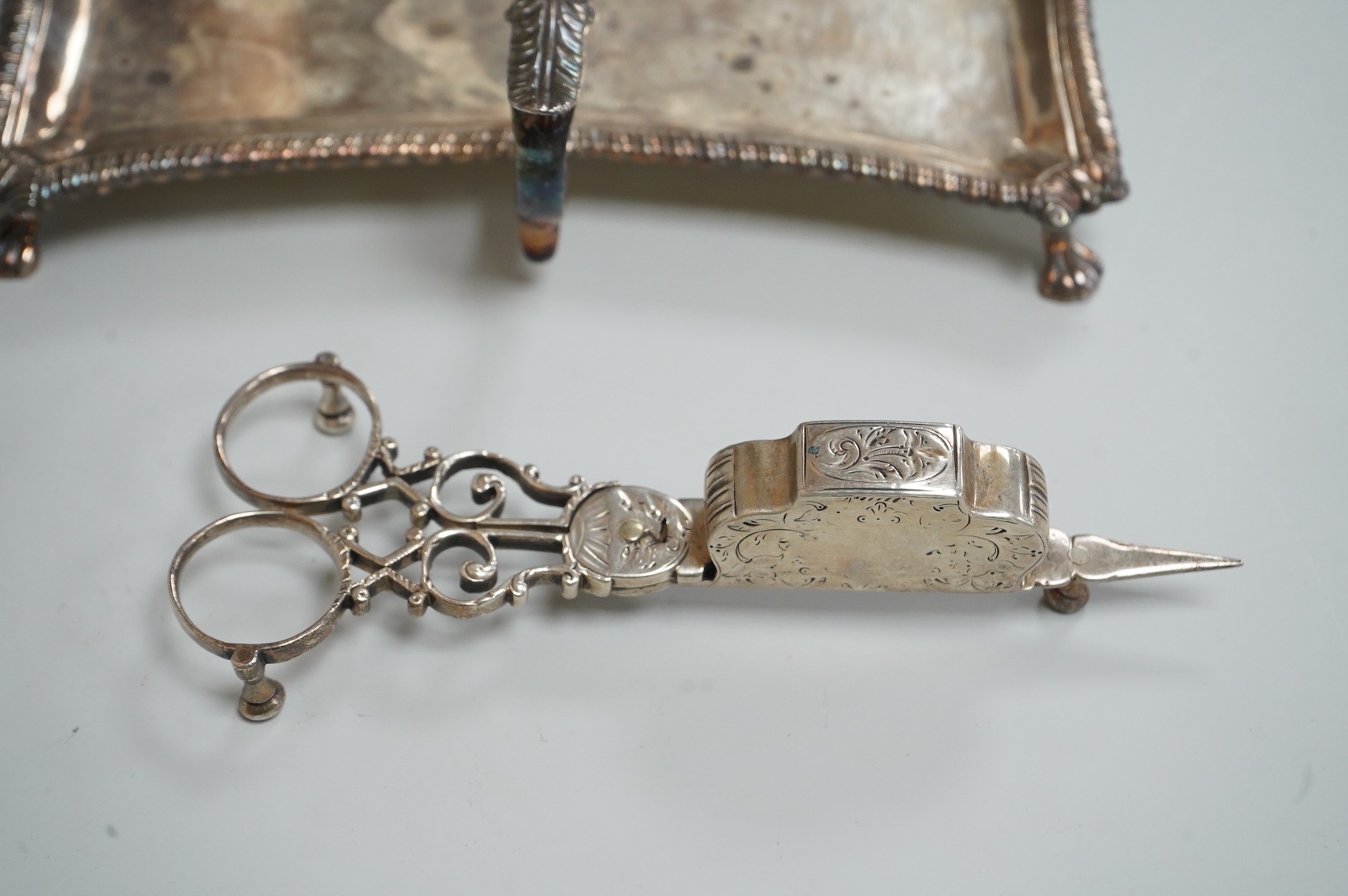 A pair late George II silver candle snuffers and similar stand, stand WC?, London, 1769, 18.5cm, snuffers I.B, London, 1769, 9oz.